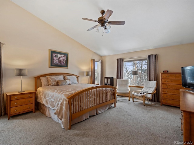 bedroom featuring vaulted ceiling, light carpet, and ceiling fan