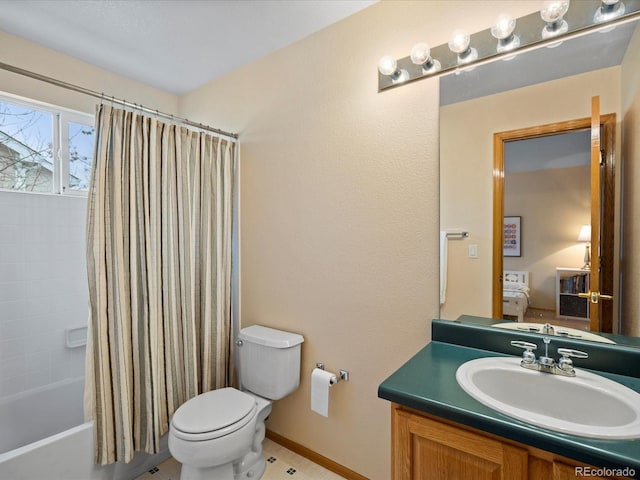 full bathroom featuring vanity, shower / bath combo with shower curtain, and toilet