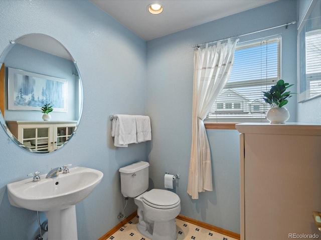 bathroom featuring sink and toilet