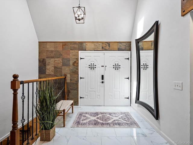 5884 S Hanover Way, Greenwood Village, CO 80111 - entrance foyer featuring marble look tiles and a chandelier