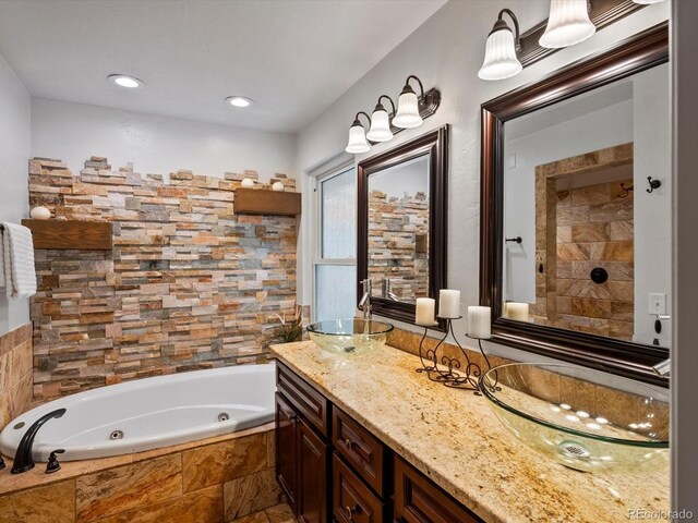 5884 S Hanover Way, Greenwood Village, CO 80111 - full bath with a tub with jets, double vanity, and recessed lighting