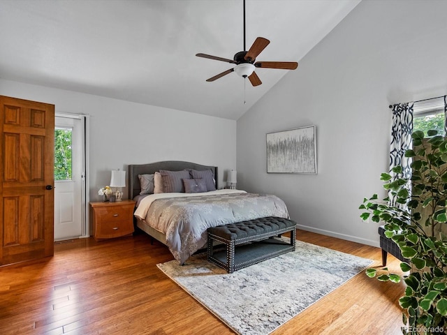 5884 S Hanover Way, Greenwood Village, CO 80111 - bedroom with multiple windows, wood finished floors, high vaulted ceiling, ceiling fan, and baseboards