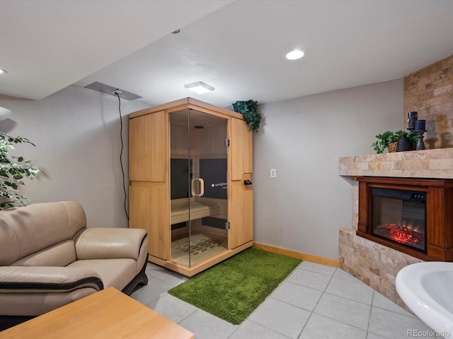 5884 S Hanover Way, Greenwood Village, CO 80111 - living room featuring a glass covered fireplace, light tile patterned flooring, baseboards, and recessed lighting