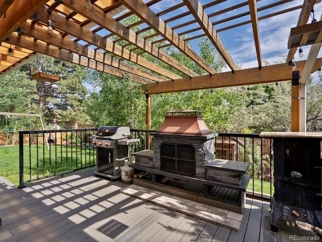 5884 S Hanover Way, Greenwood Village, CO 80111 - deck with a fireplace, area for grilling, and a lawn