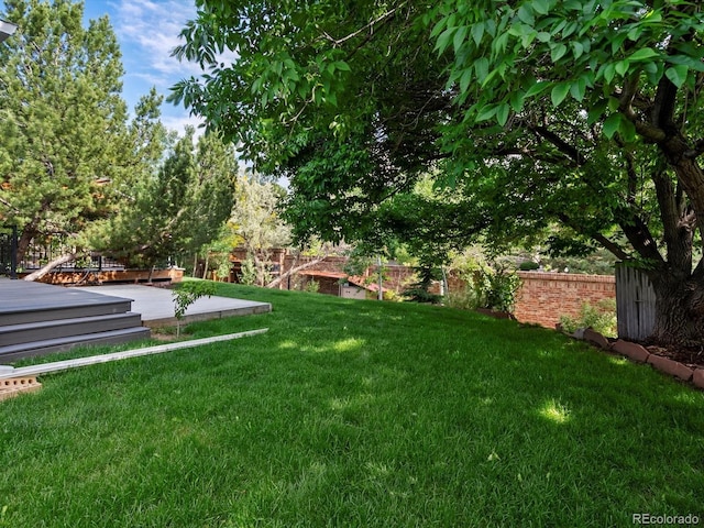 5884 S Hanover Way, Greenwood Village, CO 80111 - view of yard with a wooden deck