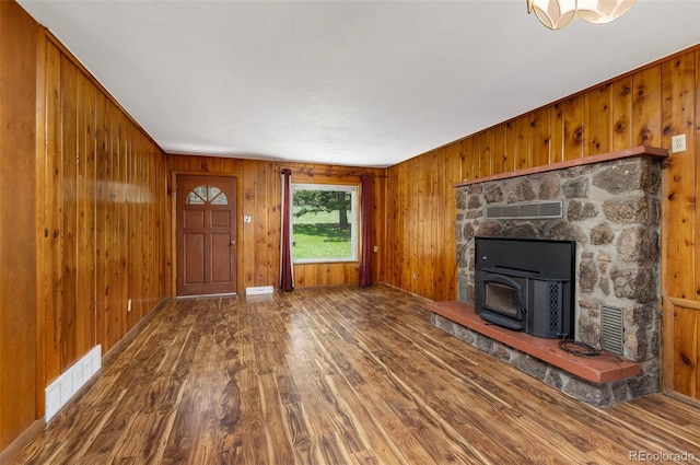 26063 Morris Ave, Conifer, CO 80433 - unfurnished living room featuring wood finished floors and wood walls