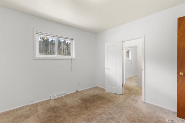 26063 Morris Ave, Conifer, CO 80433 - unfurnished bedroom featuring light carpet and baseboards