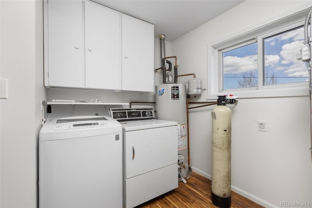 26063 Morris Ave, Conifer, CO 80433 - laundry area featuring washer and dryer, wood finished floors, gas water heater, cabinet space, and baseboards