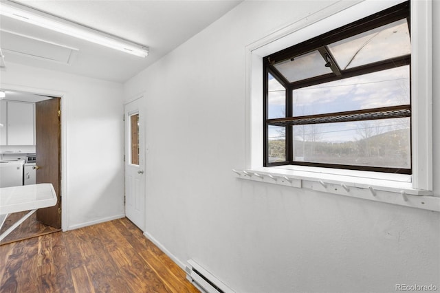 26063 Morris Ave, Conifer, CO 80433 - hall with wood finished floors, baseboards, and attic access