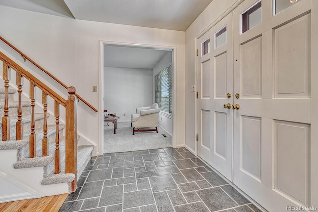 7100 S Hudson Cir, Centennial, CO 80122 - entryway with stairs, baseboards, and stone finish floor