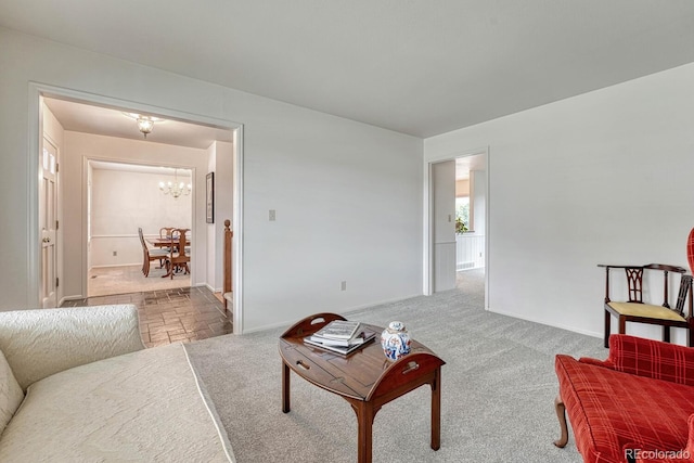 7100 S Hudson Cir, Centennial, CO 80122 - carpeted living area with an inviting chandelier and baseboards