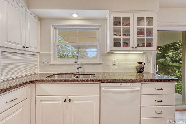 7100 S Hudson Cir, Centennial, CO 80122 - kitchen featuring a sink, glass insert cabinets, backsplash, and dishwasher