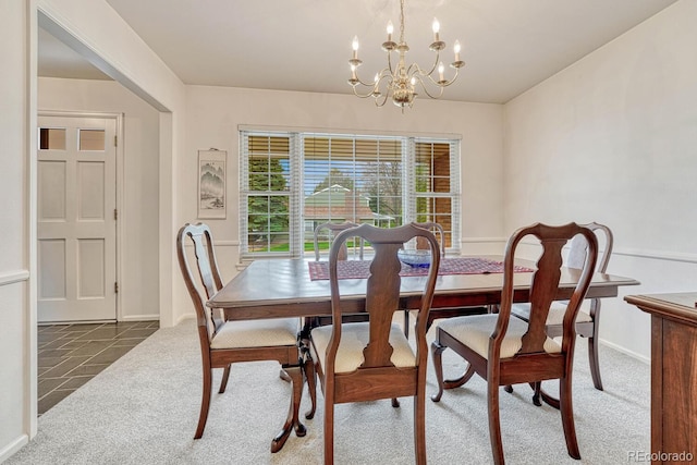 7100 S Hudson Cir, Centennial, CO 80122 - carpeted dining area featuring an inviting chandelier and baseboards