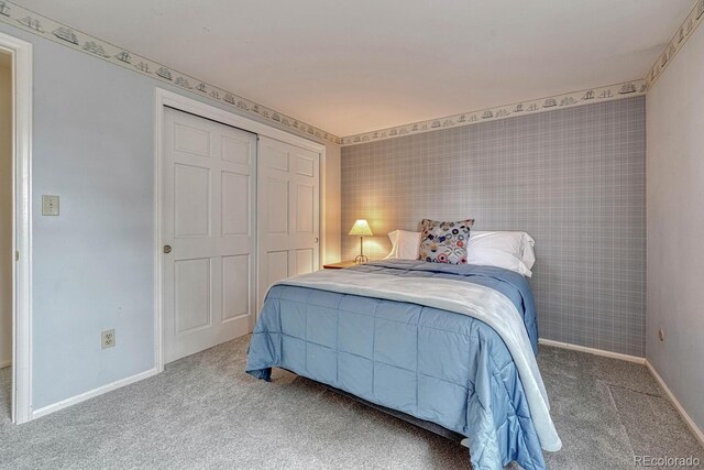 7100 S Hudson Cir, Centennial, CO 80122 - carpeted bedroom featuring baseboards and a closet