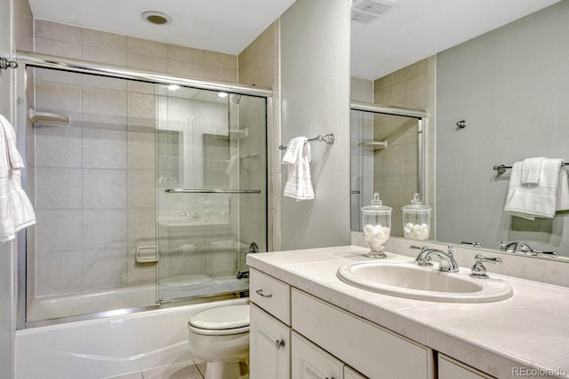 7100 S Hudson Cir, Centennial, CO 80122 - bathroom with bath / shower combo with glass door, vanity, and toilet