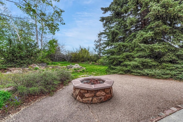 7100 S Hudson Cir, Centennial, CO 80122 - view of patio featuring an outdoor fire pit