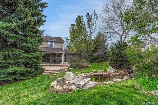 7100 S Hudson Cir, Centennial, CO 80122 - view of yard featuring a patio area and an outdoor fire pit