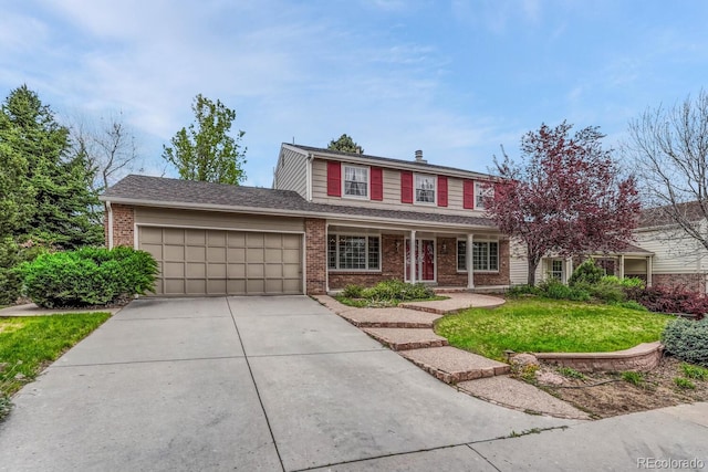 7100 S Hudson Cir, Centennial, CO 80122 - traditional-style home featuring covered porch, brick siding, an attached garage, and driveway