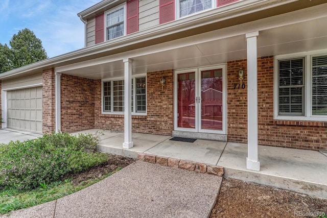 7100 S Hudson Cir, Centennial, CO 80122 - property entrance featuring a porch and brick siding