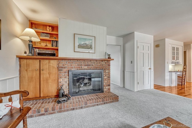 7100 S Hudson Cir, Centennial, CO 80122 - carpeted living area with a brick fireplace