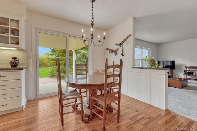 7100 S Hudson Cir, Centennial, CO 80122 - dining room with a chandelier and light wood-style floors
