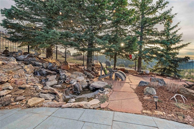 view of patio / terrace featuring fence