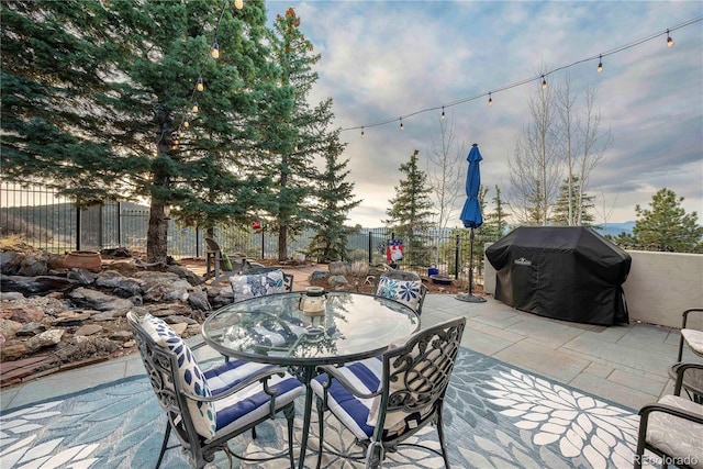 view of patio / terrace with outdoor dining area and fence