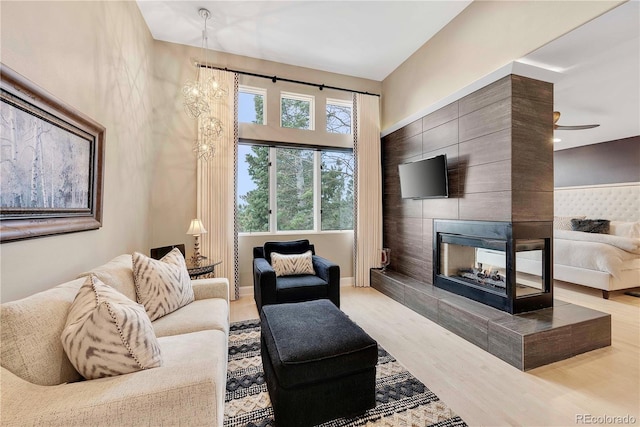 814 Neville Ln, Golden, CO 80401 - living area featuring wood finished floors and a tiled fireplace