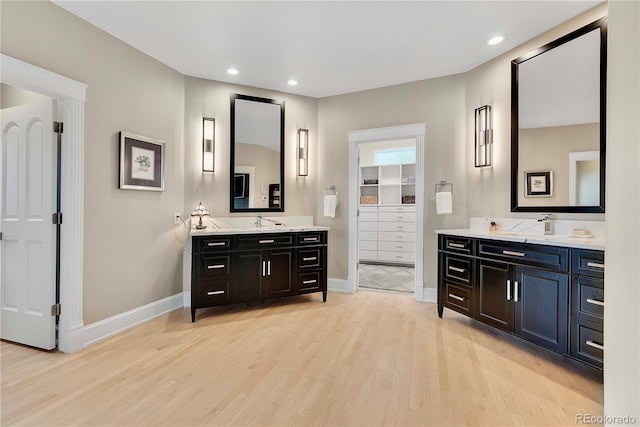 814 Neville Ln, Golden, CO 80401 - full bathroom with wood finished floors, two vanities, recessed lighting, and a walk in closet