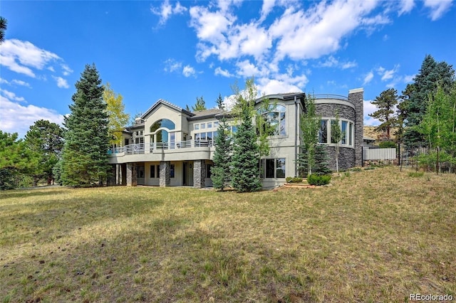 814 Neville Ln, Golden, CO 80401 - rear view of house featuring a yard, stucco siding, and stone siding