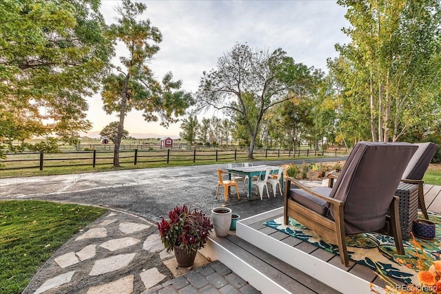 patio terrace at dusk with a rural view