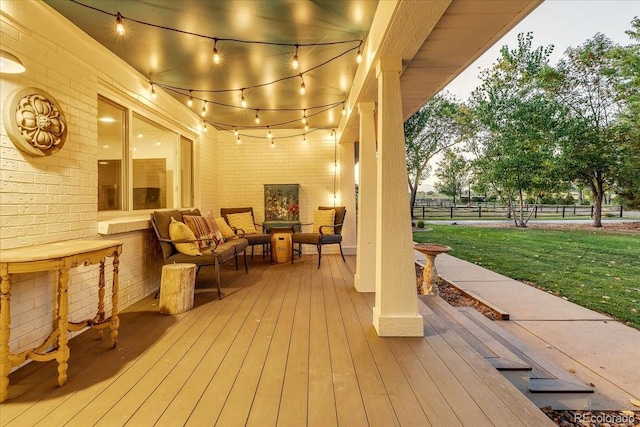 deck with outdoor lounge area and a lawn