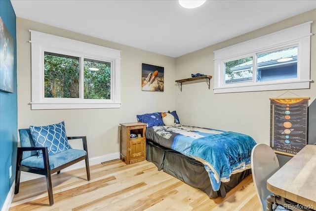 bedroom with light hardwood / wood-style floors