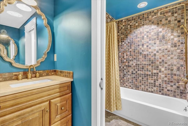 bathroom featuring vanity and shower / bath combo with shower curtain