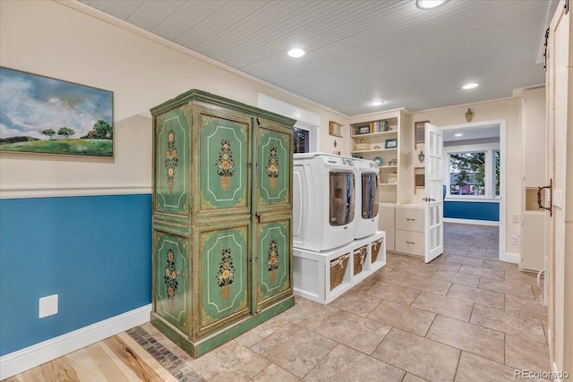 laundry room with separate washer and dryer, crown molding, and wooden ceiling