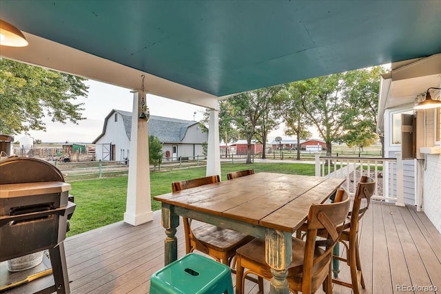 wooden deck featuring area for grilling and a yard