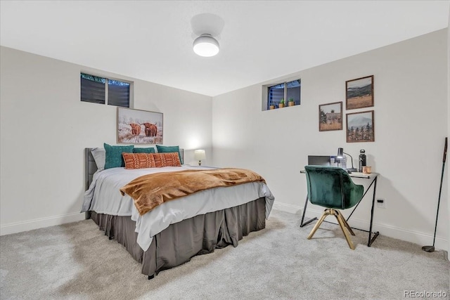 bedroom featuring light carpet