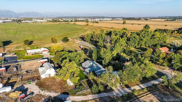 drone / aerial view featuring a mountain view and a rural view