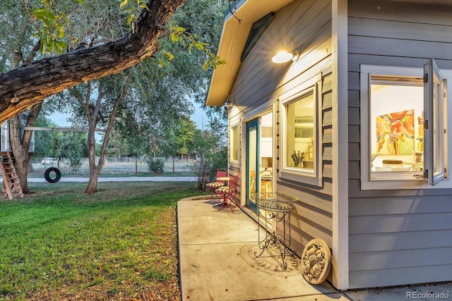 view of property exterior featuring a yard and a patio