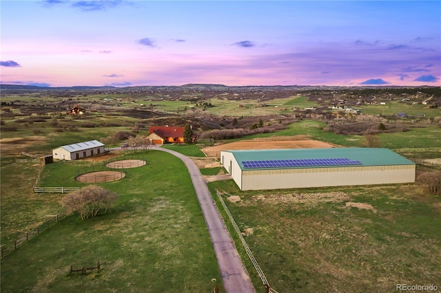 birds eye view of property with a mountain view and a rural view