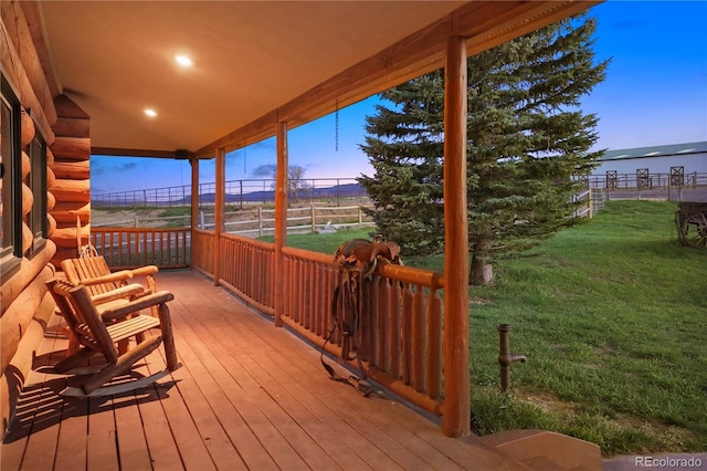 deck at dusk with a yard