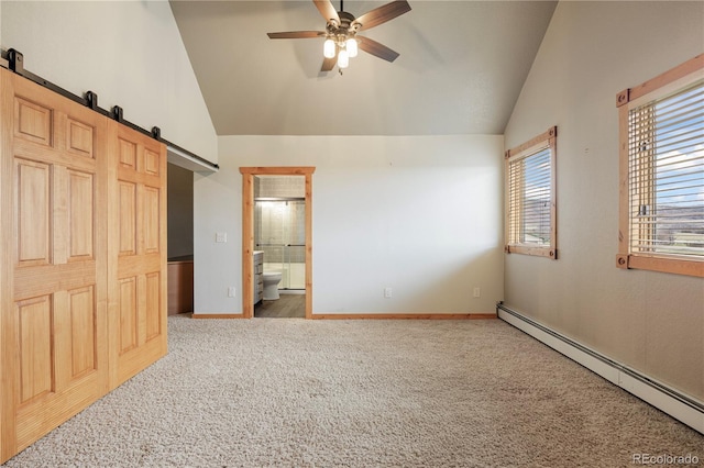unfurnished bedroom featuring carpet, connected bathroom, a barn door, vaulted ceiling, and a baseboard radiator