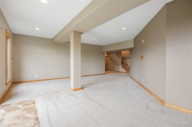 finished basement with baseboards, stairway, recessed lighting, and carpet