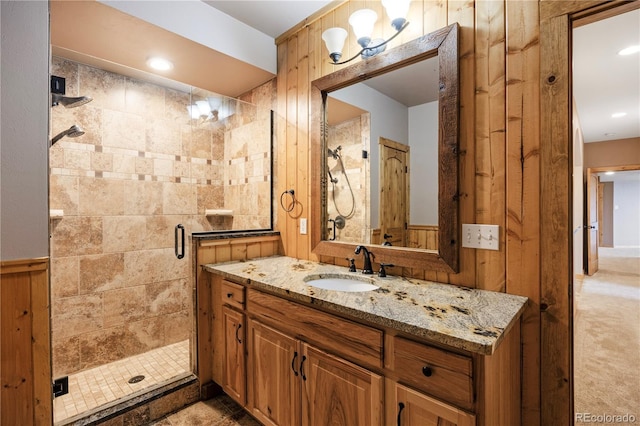bathroom with vanity and a shower stall