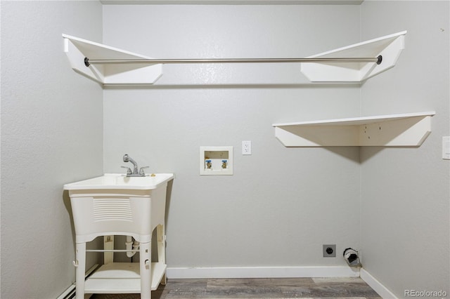washroom featuring wood finished floors, laundry area, hookup for an electric dryer, baseboards, and hookup for a washing machine