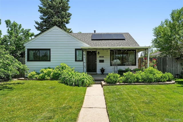 1240 Ulster St, Denver, CO 80220 - bungalow-style house with roof mounted solar panels, a shingled roof, and covered porch