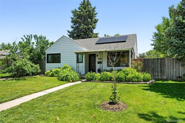 1240 Ulster St, Denver, CO 80220 - bungalow-style house with roof with shingles, solar panels, and covered porch