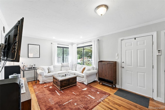 1240 Ulster St, Denver, CO 80220 - living room featuring crown molding and wood finished floors