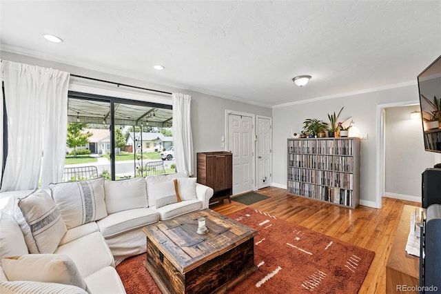 1240 Ulster St, Denver, CO 80220 - living area with ornamental molding, light wood-style floors, and recessed lighting