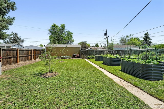 1240 Ulster St, Denver, CO 80220 - fenced backyard featuring a vegetable garden